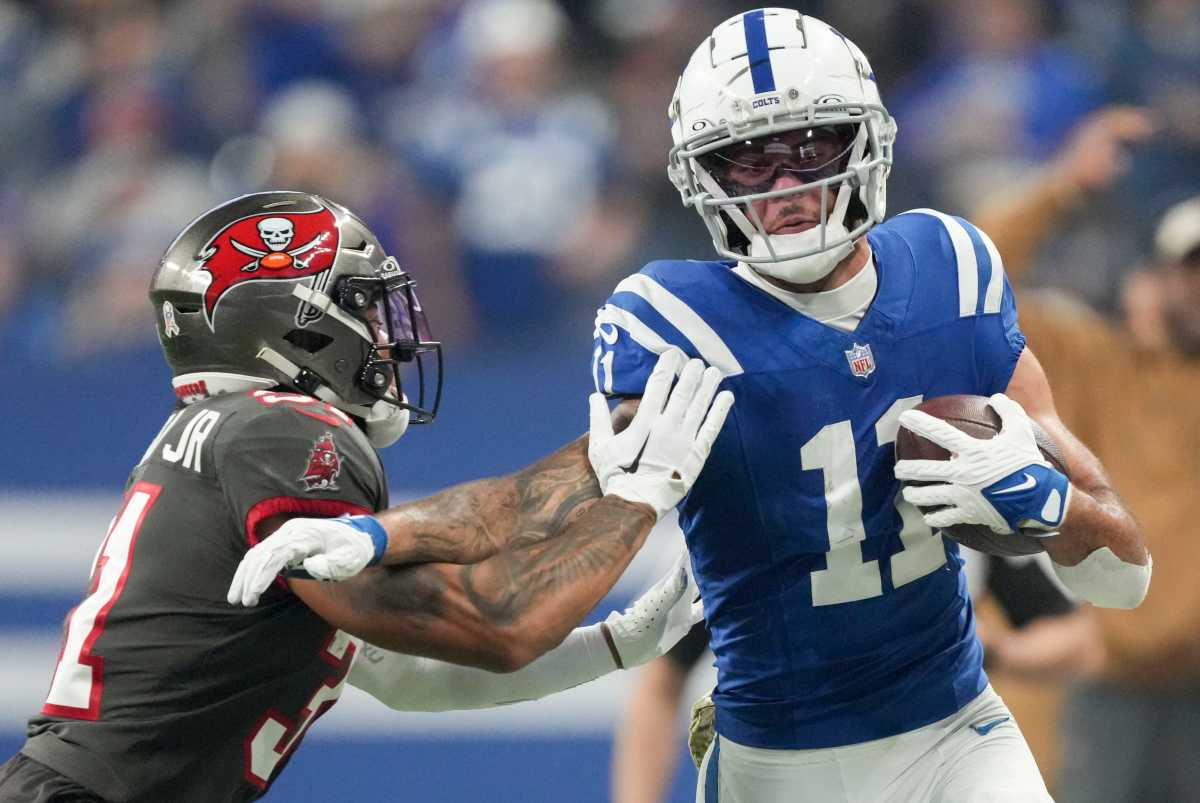Tampa Bay Buccaneers safety Antoine Winfield Jr. (31) works to push Indianapolis Colts wide receiver Michael Pittman Jr. (11) out of bounds Sunday, Nov. 26, 2023, during a game against the Tampa Bay Buccaneers at Lucas Oil Stadium in Indianapolis.  